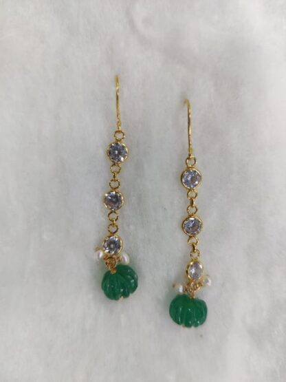 Gold earrings are 1.75 inches in length.